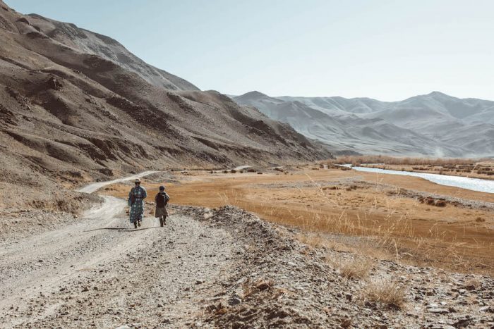 People walking through Altai Mountains in Western Mongolia itinerary